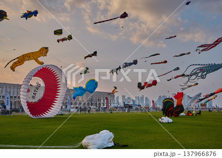 Doha, Qatar - January 20 2026: Qatar Kite Festival 2026 in Old Doha port (Mina District) sunset shot showing spectacular showcase of colorful kites soaring across the picturesque Doha skyline. Doha, Qatar - January 20 2026: Qatar Kite Festival 2026 in Old Doha port (Mina District) sunset shot showing spectacular showcase of colorful kites soaring across the picturesque Doha skyline. 137966876