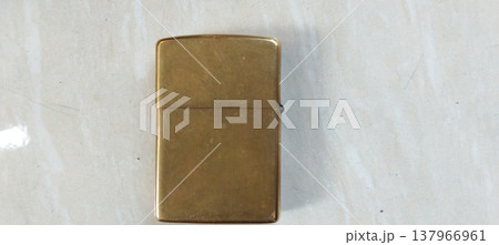 Antique Brass Lighter on Marble Surface Antique Brass Lighter on Marble Surface 137966961