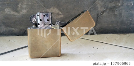 Antique Brass Lighter on Marble Surface Antique Brass Lighter on Marble Surface 137966963