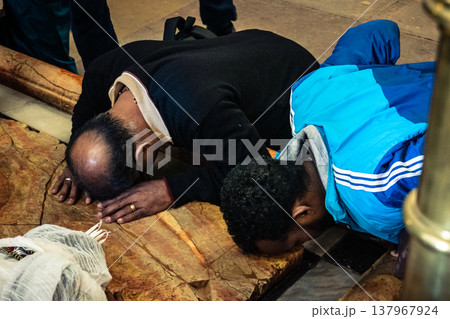 Orthodox priest standing in the Church of the Holy Sepulchre in Jerusalem. Orthodox priest standing in the Church of the Holy Sepulchre in Jerusalem. 137967924