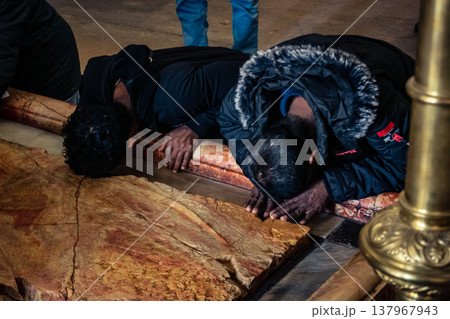 Orthodox priest standing in the Church of the Holy Sepulchre in Jerusalem. Orthodox priest standing in the Church of the Holy Sepulchre in Jerusalem. 137967943