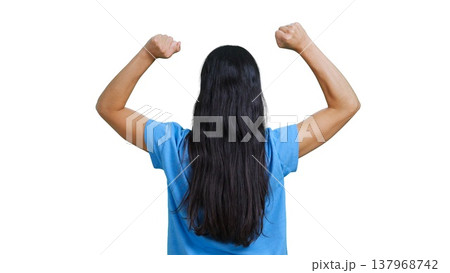Woman with her back turned raising fists celebrating success and winning Woman with her back turned raising fists celebrating success and winning 137968742