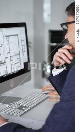 Architects and engineers collaborating on a project, analyzing construction blueprints with drafting tools during client meeting. Business people and architecture concept 137970096