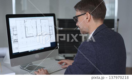 Architect developing building blueprint on computer, engineering and urban planning a new construction project. Business and architecture concept Architect developing building blueprint on computer, engineering and urban planning a new construction project. Business and architecture concept 137970218