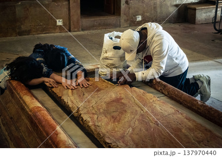 Christian pilgrims' hands on the Stone of Anointing, Holy Sepulchre. Christian pilgrims' hands on the Stone of Anointing, Holy Sepulchre. 137970440