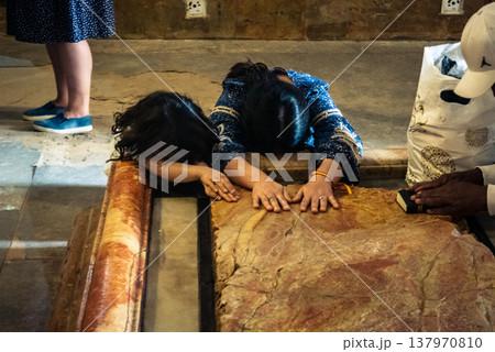 Christian pilgrims' hands on the Stone of Anointing, Holy Sepulchre. Christian pilgrims' hands on the Stone of Anointing, Holy Sepulchre. 137970810