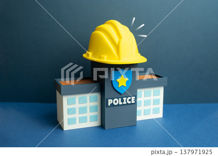 A police building with a yellow construction helmet. Construction and renovation of a police station. Reforms in law enforcement improve infrastructure, modern facilities support public safety systems 137971925