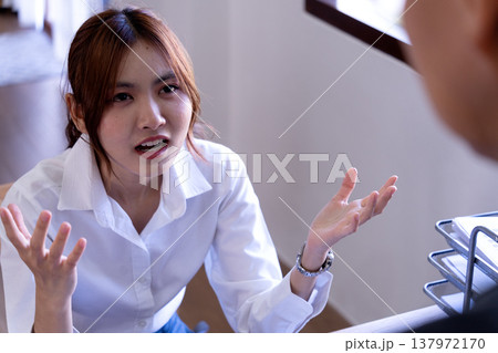 Manager showing dissatisfaction with subordinates late 137972170