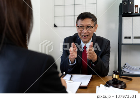 Lawyer manager elaborating on corporate legal Lawyer manager elaborating on corporate legal 137972331