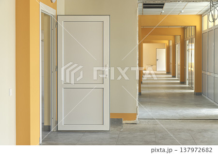 Modern hallway interior with doors in a building undergoing renovation 137972682