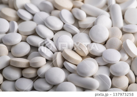 Heap of medicine white pills macro shot Heap of medicine white pills macro shot 137973258
