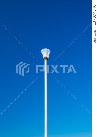 lamppost on a blue sky background lamppost on a blue sky background 137974340