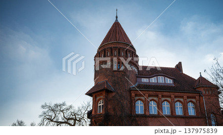 Historic Red Brick Tower Under Blue Sky Historic Red Brick Tower Under Blue Sky 137975839