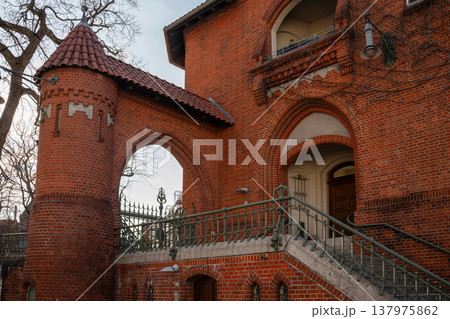 Historic Red Brick Archway with Staircase and Tower 137975862
