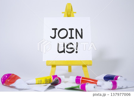 Join us symbol. Concept word Join us on wooden blocks. Beautiful white background with paints and easel. Business and Join us concept. Copy space Join us symbol. Concept word Join us on wooden blocks. Beautiful white background with paints and easel. Business and Join us concept. Copy space 137977006