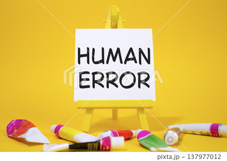 Human Error symbol. Concept word Human Error on wooden blocks. Beautiful yellow background with paints and easel. Medicine and Human Error concept. Copy space Human Error symbol. Concept word Human Error on wooden blocks. Beautiful yellow background with paints and easel. Medicine and Human Error concept. Copy space 137977012