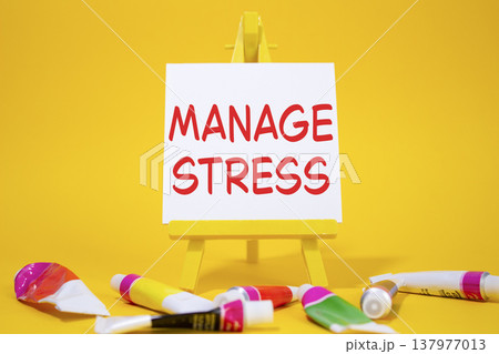 Manage stress symbol. Concept word Manage stress on wooden blocks. Beautiful yellow background with paints and easel. Business and Manage stress concept. Copy space Manage stress symbol. Concept word Manage stress on wooden blocks. Beautiful yellow background with paints and easel. Business and Manage stress concept. Copy space 137977013