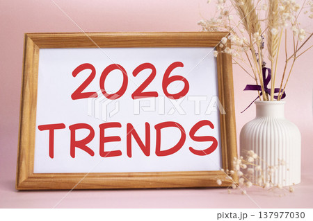 2026 Trends symbol. Concept words 2026 Trends on beautiful wooden picture frame. Beautiful pink background with flower vase. Business and 2026 Trends concept. Copy space. 2026 Trends symbol. Concept words 2026 Trends on beautiful wooden picture frame. Beautiful pink background with flower vase. Business and 2026 Trends concept. Copy space. 137977030