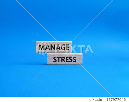 Manage stress symbol. Concept word Manage stress on wooden blocks. Beautiful blue background. Business and Manage stress concept. Copy space 137977046