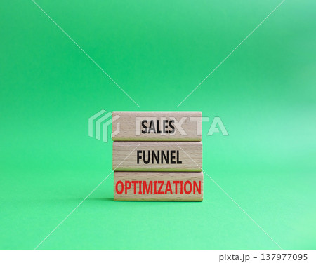 Sales Funnel Optimization symbol. Concept word Sales Funnel Optimization on wooden blocks. Beautiful green background. Business and Sales Funnel Optimization. Copy space 137977095