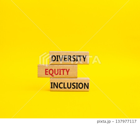 Diversity Equity Inclusion symbol. Concept words Diversity Equity Inclusion on wooden blocks. Beautiful yellow background. Business and Diversity Equity Inclusion concept. Copy space Diversity Equity Inclusion symbol. Concept words Diversity Equity Inclusion on wooden blocks. Beautiful yellow background. Business and Diversity Equity Inclusion concept. Copy space 137977117
