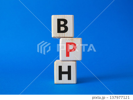 BPH - Benign Prostatic Hyperplasia symbol. Wooden cubes with word BPH. Beautiful blue background. Medical and BPH concept. Copy space. BPH - Benign Prostatic Hyperplasia symbol. Wooden cubes with word BPH. Beautiful blue background. Medical and BPH concept. Copy space. 137977121