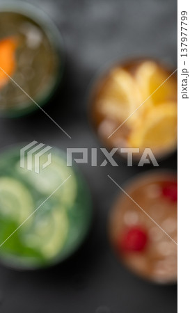 Vertical blurred cocktail background colorful drinks Vertical blurred cocktail background colorful drinks 137977799