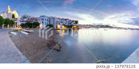 Small boats on beach below Santa Maria church in Cadaques at blue hour, Catalonia 137978128