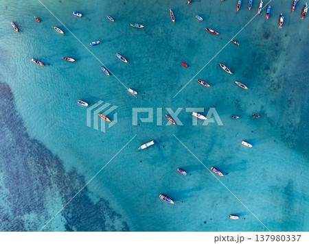 Aerial drone bird's eye view photo Top down of tropical sea with long tail fishing boats at phuket thailand 137980337