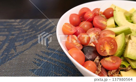 Fresh Vegetable Salad with Cherry Tomatoes and Avocado Fresh Vegetable Salad with Cherry Tomatoes and Avocado 137980564