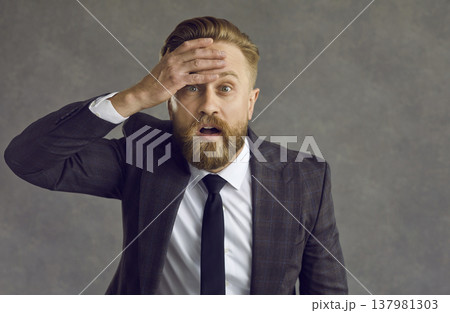 Portrait of a shocked businessman who is affected by the coronavirus crisis and financial losses. Portrait of a shocked businessman who is affected by the coronavirus crisis and financial losses. 137981303