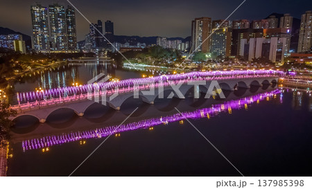 Vibrant Night Lights Illuminate Festive Bridge Over Shing Mun 137985398