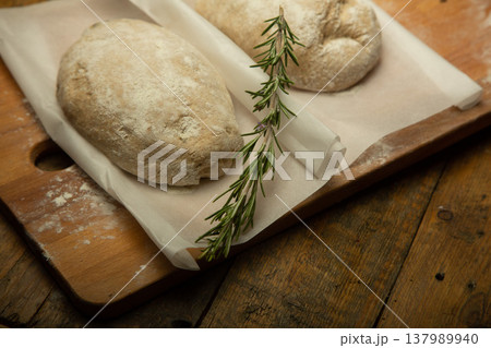 Fresh homemade bread. Italian ciabatta with rosemary Fresh homemade bread. Italian ciabatta with rosemary 137989940