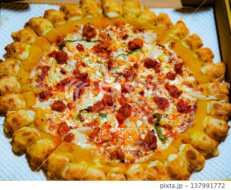 mexican Pizza with Melted Cheese and Crispy Crust on box 137991772