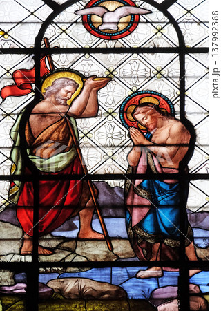 Baptism of the Christ, stained glass window in the Basilica of Notre Dame des Victoires in Paris, France Baptism of the Christ, stained glass window in the Basilica of Notre Dame des Victoires in Paris, France 137992388