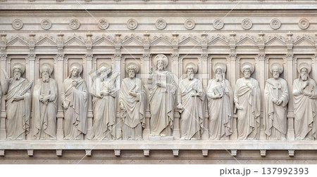 Jesus Christ with Apostles, facade of Saint Augustine church in Paris, France 137992393
