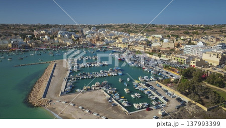 Malta: Aerial drone capturing the picturesque Marsaxlokk harbor in Malta. Drone flight Malta: Aerial drone capturing the picturesque Marsaxlokk harbor in Malta. Drone flight 137993399
