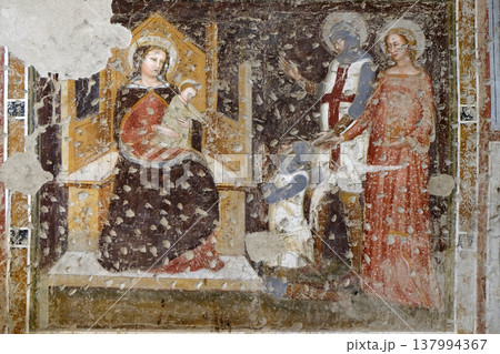 Enthroned Madonna and Child, Saints George, Catherine and a worshipper Knight, fresco in the church of San Pietro Martire in Verona, Italy 137994367