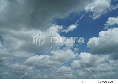 Blue Sky Filled with White Clouds on a Summer Day 137995391