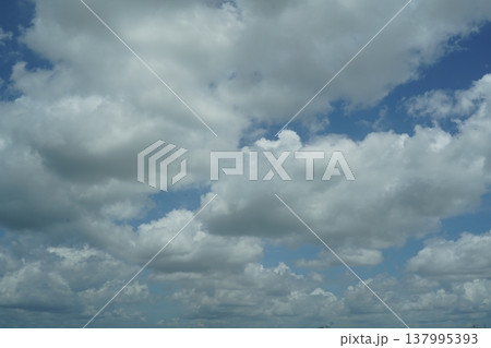 Clouds Against a Blue Sky on a Sunny Day 137995393