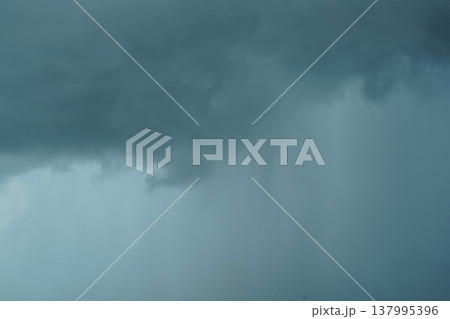 Dramatic sky with dark storm clouds approaching rain Dramatic sky with dark storm clouds approaching rain 137995396
