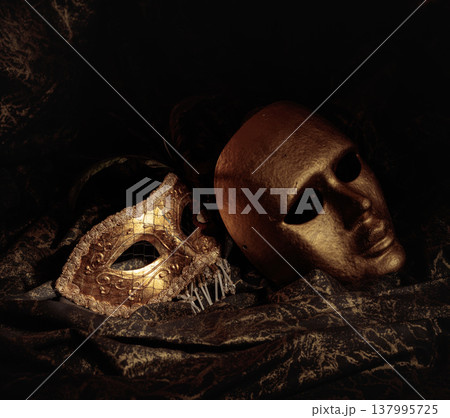 Golden carnival masks on a dark background. 137995725