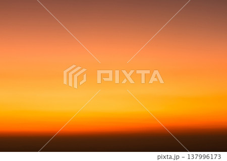 Abstract warm gradient sky at sunset with soft blur and glowing orange-to-yellow tones, minimal background with copy space for summer travel, meditation, branding and design for web banners. Abstract warm gradient sky at sunset with soft blur and glowing orange-to-yellow tones, minimal background with copy space for summer travel, meditation, branding and design for web banners. 137996173