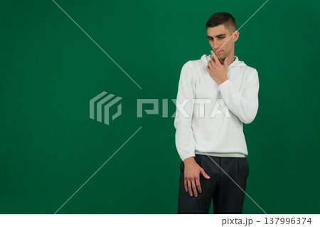 Serious, pensive bearded man sitting in cozy living room looking away, middle aged male thinking. Planning strategy concept Serious, pensive bearded man sitting in cozy living room looking away, middle aged male thinking. Planning strategy concept 137996374