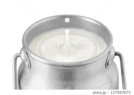 Drop falling in retro milk can and created splash with circle ripple isolated on white background Drop falling in retro milk can and created splash with circle ripple isolated on white background 137997675
