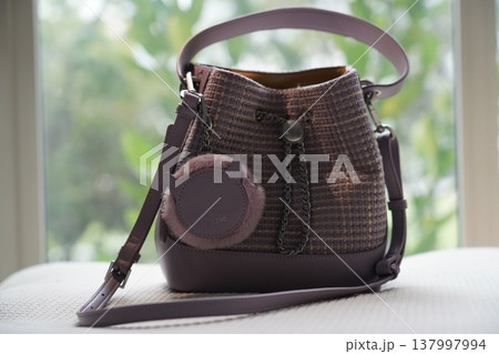 Stylish Purple Bucket Bag with Charm Fashion Accessory 137997994