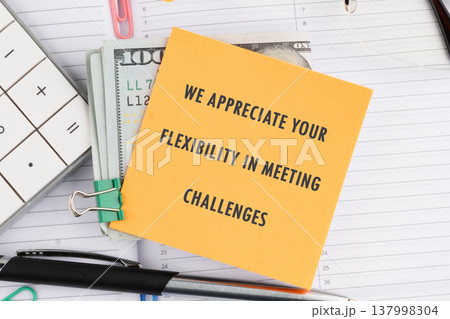 A heartfelt thank you for excellent adaptability, presented with a monetary reward, pen, calculator, and colorful paperclips on a desk A heartfelt thank you for excellent adaptability, presented with a monetary reward, pen, calculator, and colorful paperclips on a desk 137998304