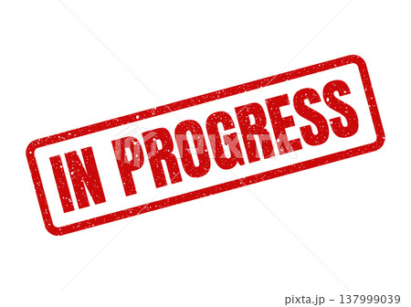 Prominent red distressed rubber stamp indicating IN PROGRESS status, suitable for project management and workflow communication 137999039