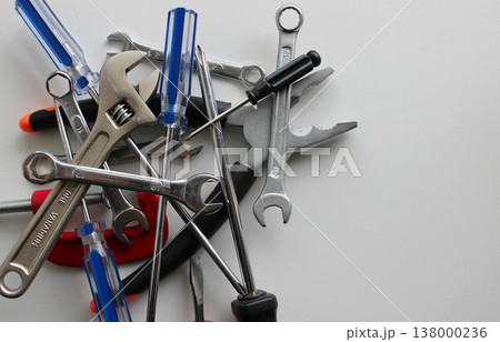 Bunch Of Colors Pliers, Wrenches, Spanners, Screwdrivers, Clamps And Hex Keys Isolated On White At A Side Of Image Bunch Of Colors Pliers, Wrenches, Spanners, Screwdrivers, Clamps And Hex Keys Isolated On White At A Side Of Image 138000236