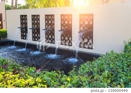A composition of mini waterfalls at the entrance to the hotel A composition of mini waterfalls at the entrance to the hotel 138000440